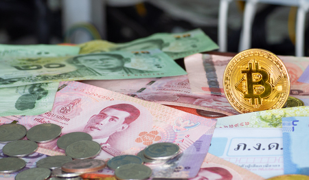 Crypto Currency  bitcoin coin With Thai currency And pay taxes,Concept Determining the tax law of digital money.の写真素材