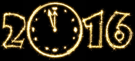 Number 2016 with clock made by sparkler. Isolated on a black background