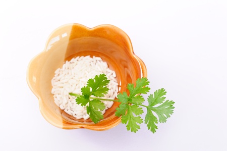 parsley on rice in bowlの写真素材