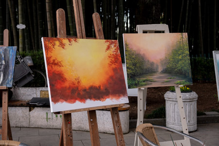 Painting in the park. Picture on the easel. Picture on the street.