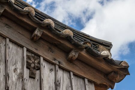 Korean traditional style tiled and wooden roof in the Yangdong Folk Village. Gyeongju, South Korea, Asia.の写真素材