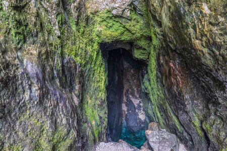 View on Source of SoÄa River, Main Pond Cave in Julian Alps. Bovec, Gorizia, Slovenia, Europe.の写真素材