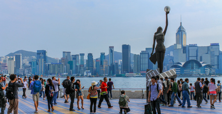 Central Monument of Avenue of Stars and Street Scenario of promenade. Skyline of Hongkong Island in background. Hong Kong, China.のeditorial素材