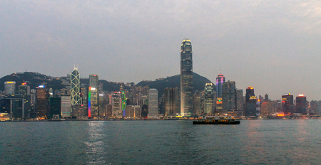 Famous Light Show Skyline Panorama with Victoria Bay, Star Ferry and Hongkong Island in the background. Hong Kong, China, Asiaのeditorial素材