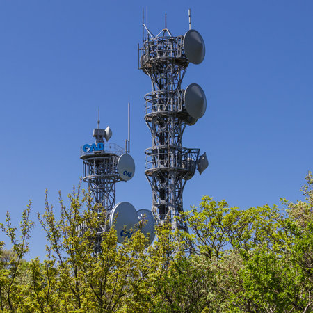 Detail view on Telecommunication and Television Tower inside Nature on the top of Mount Tsurumi....