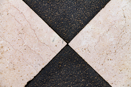 Texture of black and white stone, tiles laid out in mosaicの写真素材