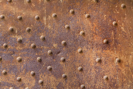 Rusty metal from metal rivets, beautiful metal texture, metallic backgroundの写真素材