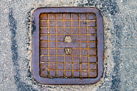 Hatch cover, city drain on the road, city sewerageの写真素材