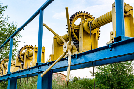 Vintage elevator gear, winch, cable, large gears for backdropの写真素材