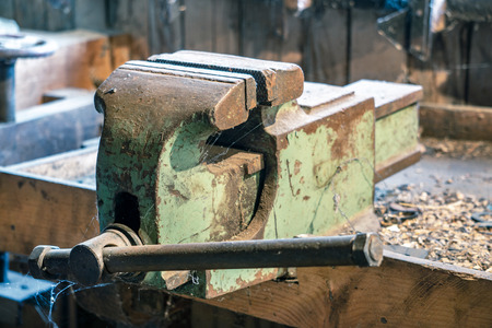 old vise on the desktop of a rural carpenterの写真素材