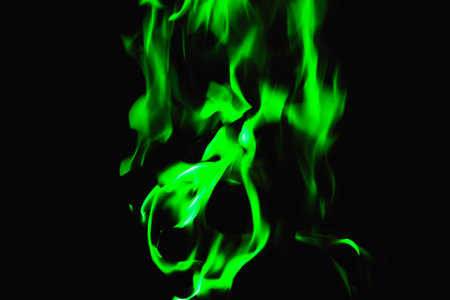 green flame on black background, background for placing textの写真素材