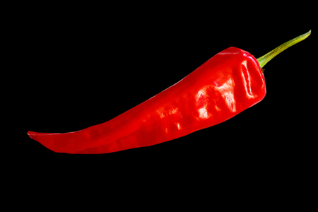 Red hot chili pepper, on black background, food itemの写真素材
