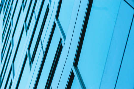 Office building windows background. Glass facade of an office buildingの写真素材