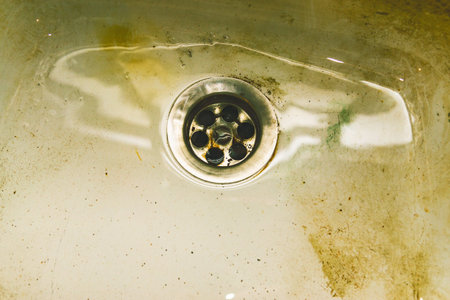 Water flows into the sink, sink and running water for the background, metal sinkの写真素材