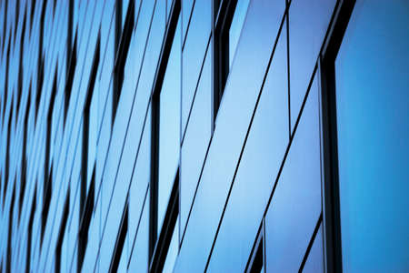 Office building windows background. Glass facade of an office buildingの写真素材