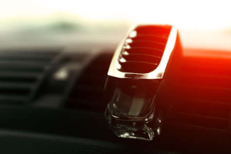 Air freshener in car vent, black interior, car deflectors, fresh air.の写真素材