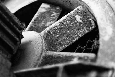 Fan with engine mounted in a brick wall. Large fan blades rotateの写真素材