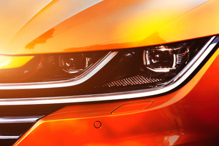 Modern lens headlight on the car. Car light