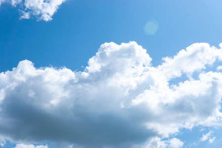 Large fluffy clouds in the blue sky.の写真素材