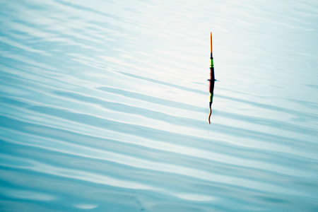 Fishing float in the water. Fishing on the lakeの写真素材