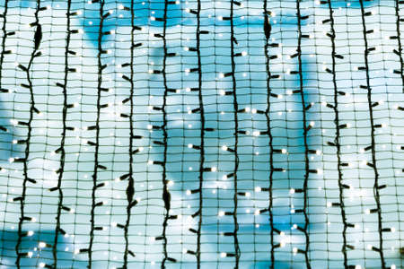 Christmas lights. Garland on a blue backgroundの写真素材