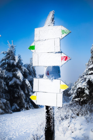 Arrow pointer Winter snow-capped mountains. Place for text