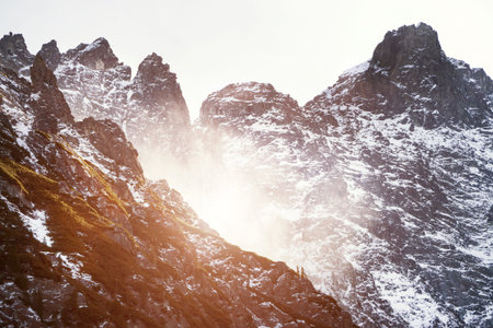 Fog on the mountain. Snow-capped mountains in the Alps