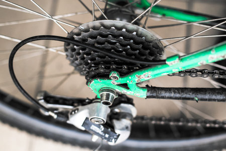 A close-up of the mechanism of cycling mechanisms and a mountain bike chain.