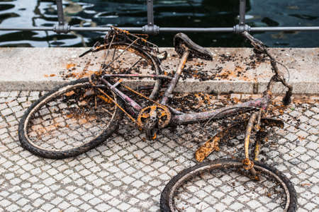 An old sunken Bicycle that was pulled out of the waterの写真素材