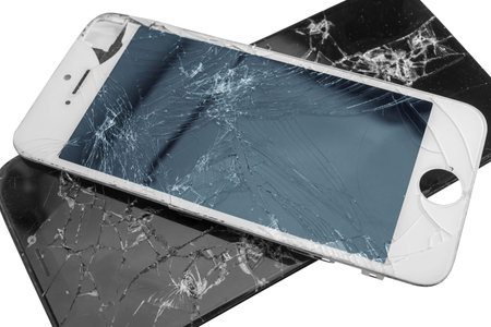 Two broken phones isolated on white background, broken screen