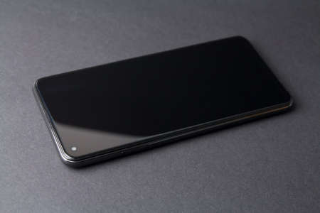 Black smartphone on a black background, offの写真素材
