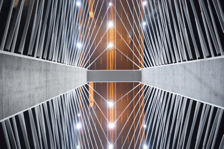 Steel pylons of the bridge at night, illuminated cables on the bridge, close-up. view from above. Redzinski Bridge Poland. Wroclawの写真素材