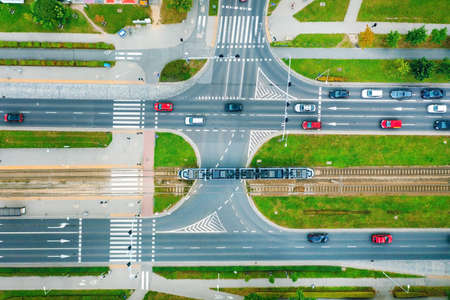 A road in the city with a top view, trams and cars are passing along the road, Poland, Wroclawの写真素材