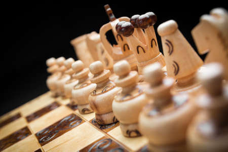 chess on a black background, a lot of chess piecesの写真素材