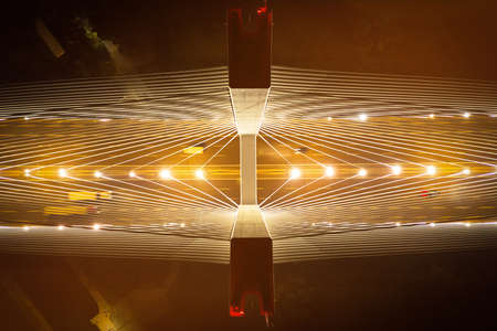 Steel pylons of the bridge at night, illuminated cables on the bridge, close-up. view from above. Redzinski Bridge Poland. Wroclawの写真素材