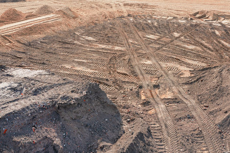 Aerial view at the construction site during earthworks progress.