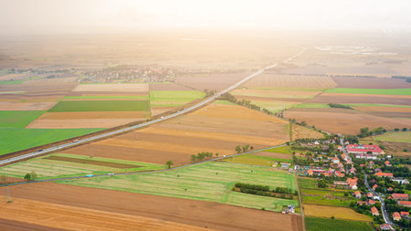 Nice view of the multi-colored fields from a great height. Aerial photography. Agriculture