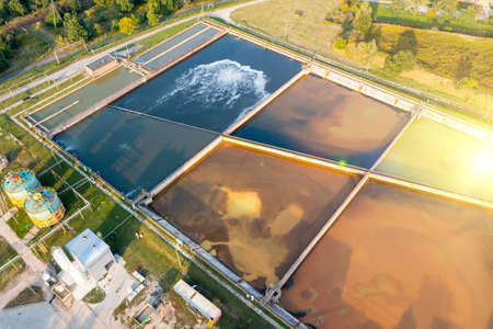 A group of large sedimentation tanks. Water settling, cleaning in a reservoir with biological organisms at a water station. different degree of wastewater treatmentの写真素材