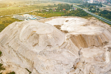 large piles of sand on a sand quarry