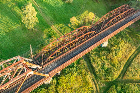 Old railway bridge over the field, top viewの写真素材