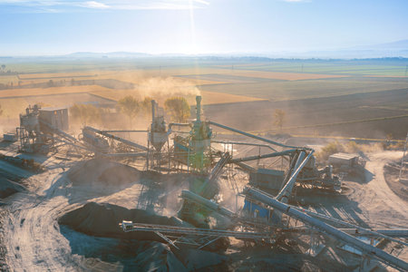 Granite quarry against a background of blue sky, large piles of stone and huge deposits of granite...