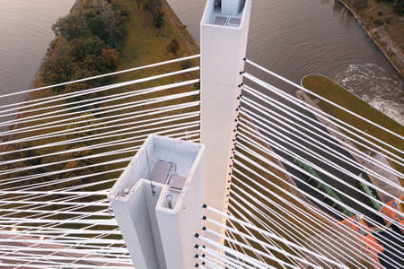 White pylons of the bridge illuminated at dusk, top viewの写真素材