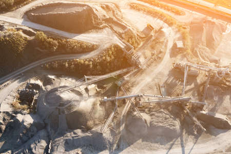 Aerial view of a gravel pit in Poland. Conveyor belts distribute the stone. Heavy industryの写真素材
