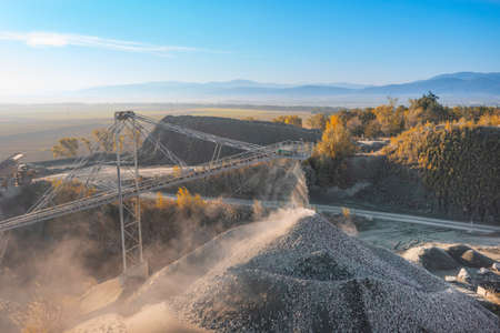 Stone crushing machine. Falling stones in the quarryの写真素材