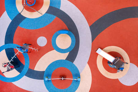 Top view of the playground with bright circular patterns, soft flooring in the playgroundの写真素材