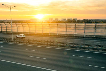 Autobahn and sunset in the background, roadの写真素材