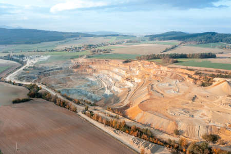 Stone quarry from above. Extraction of sand and stone in a huge quarry. View from a great height, beautiful rocks in a deep quarryの写真素材