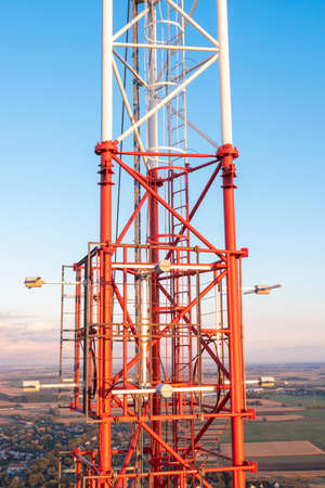 Telecommunication tower with antennas on blue sky backgroundの写真素材