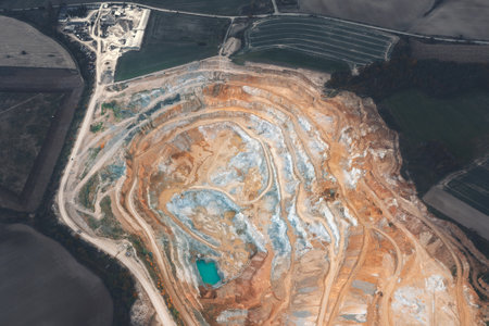 Sand quarry from a great height, beautiful orange patterns on the rocksの写真素材