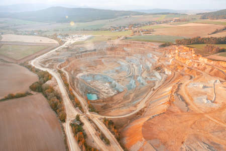 Stone quarry from above. Extraction of sand and stone in a huge quarry. View from a great height, beautiful rocks in a deep quarryの写真素材